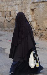 1024px-A_female_member_of_the_Haredi_burqa_sect_in_Mea_Shearim.jpg