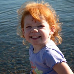 Taylor throwing rock in Lake Superior