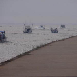 142 Charter boats headed out for evening fishing on Lake Michigan, Manistee Michigan 2010