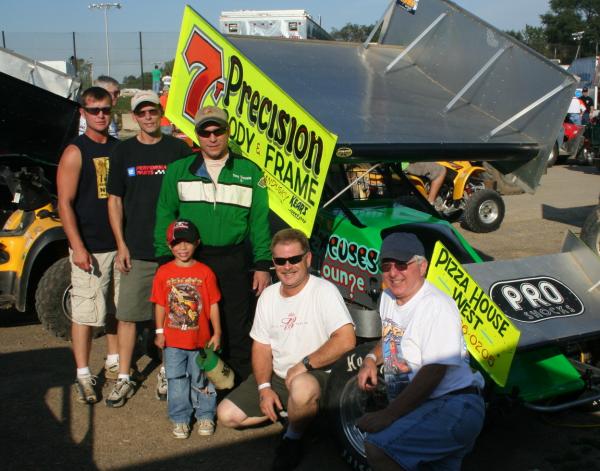 7T Crew  l to r Christan, Dave ,Tyler, Troy (in suit), me and Jim. 120+ years of racing experience in that pic.