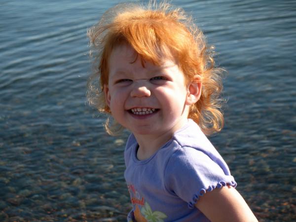 Taylor throwing rock in Lake Superior